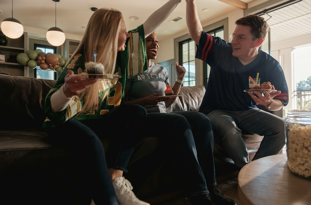 family laughing at board game