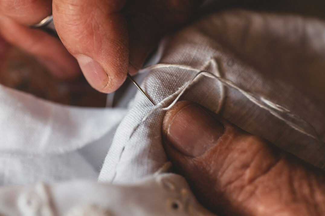 woman sewing fabric